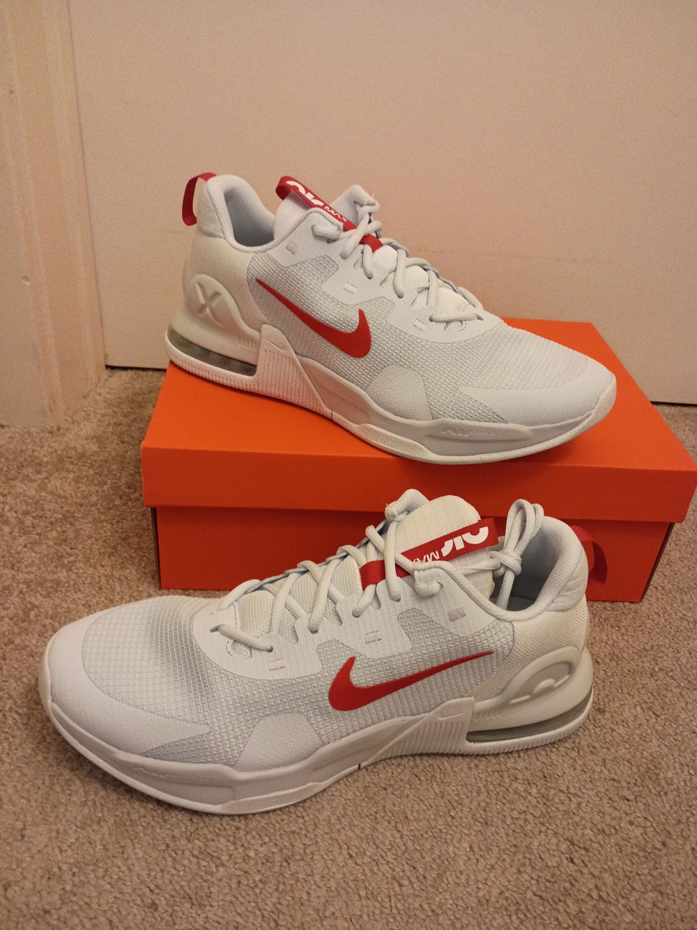 Nike Men's White Athletic Shoes with Red Swoosh